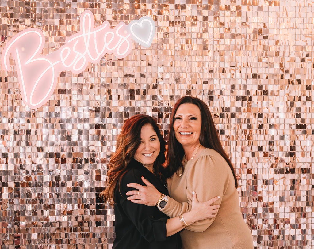 Two pretty women looking very happy